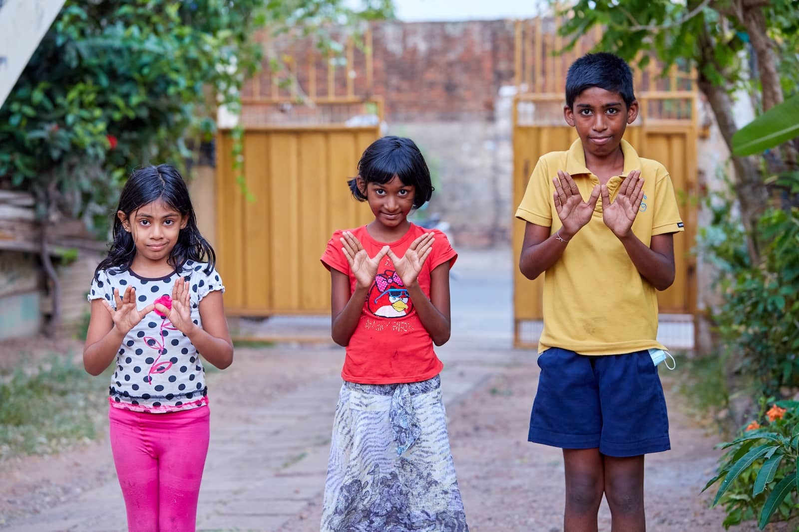 Children doing the W for world mosquito program