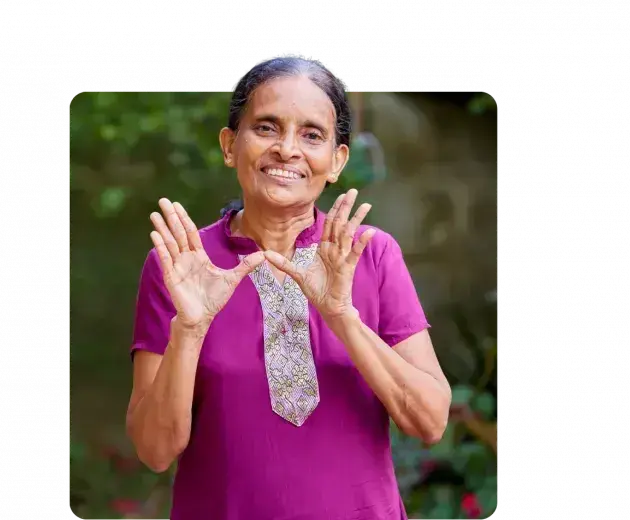 World Mosquito Program - woman showing the W sign for Wolbachia