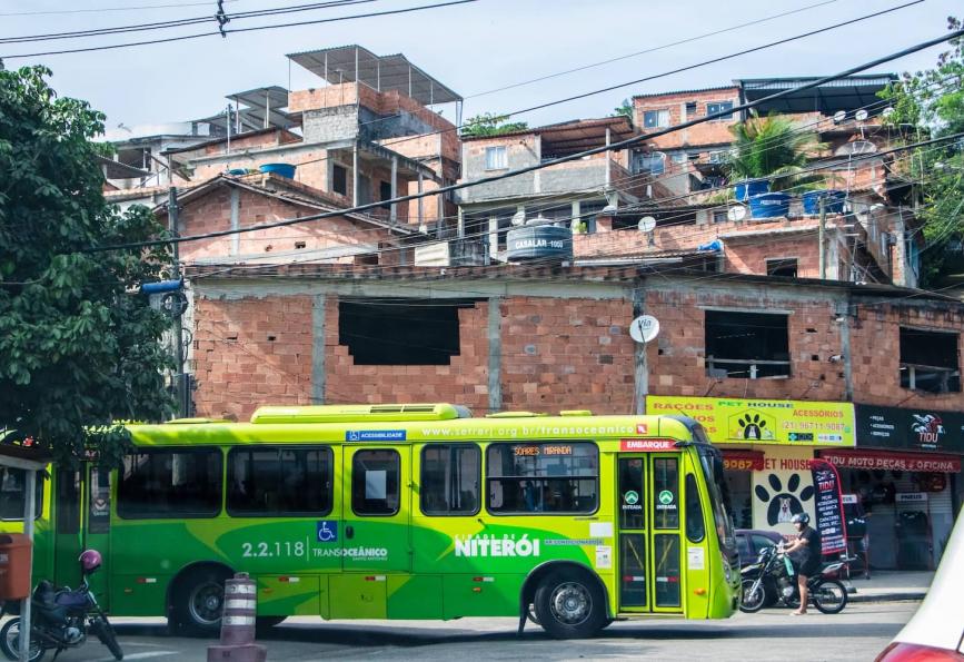 Green bus in driving through the city of Niteroi where the World Mosquito Program has deployed its wolbahcia method